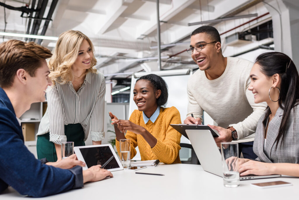 young happy coworkers working together in a communal work space